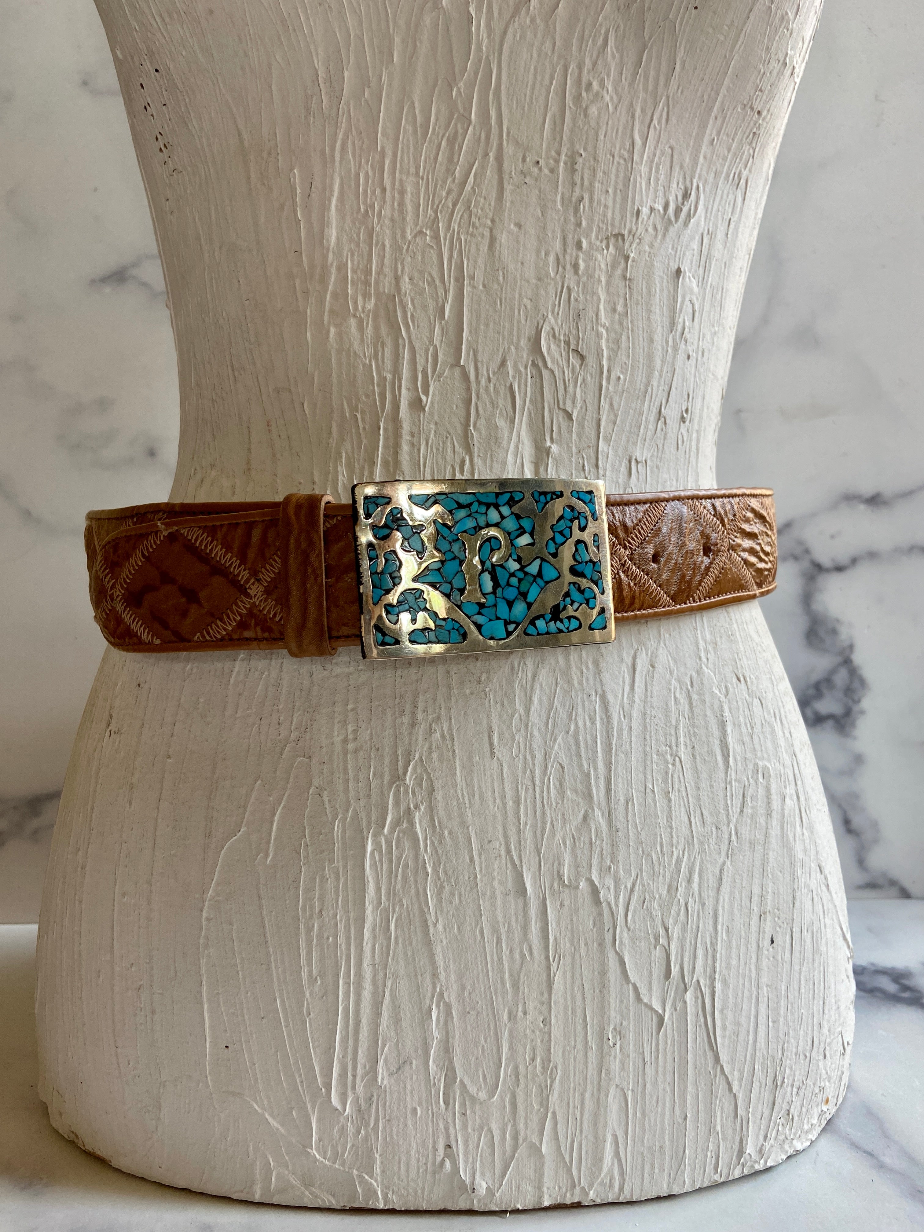 Turquoise Belt Buckle in a vintage leather tooled belt