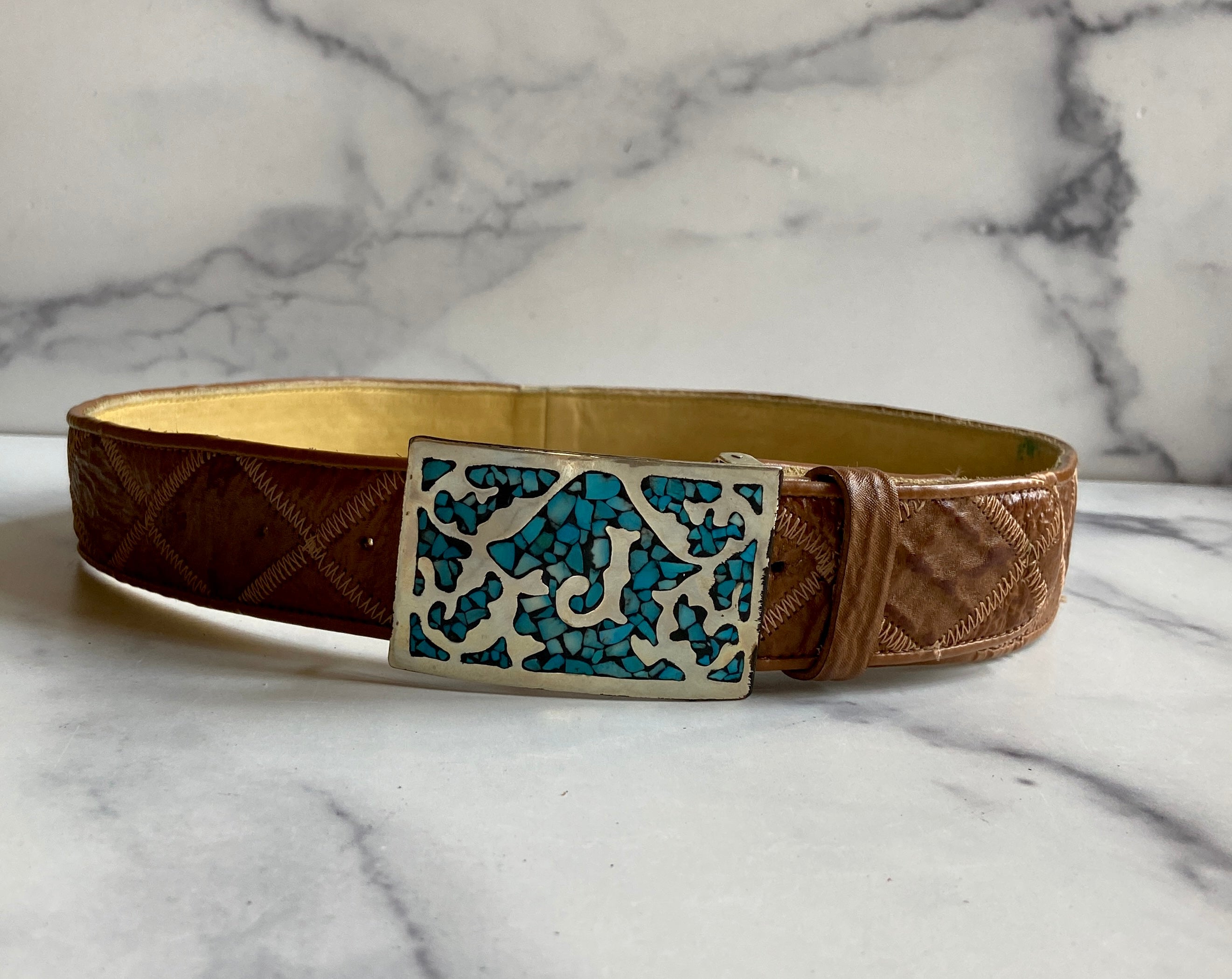 Turquoise Belt Buckle in a vintage leather tooled belt