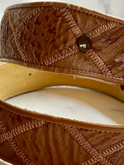 Turquoise Belt Buckle in a vintage leather tooled belt