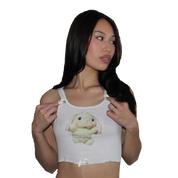 banana cookie . white tank .