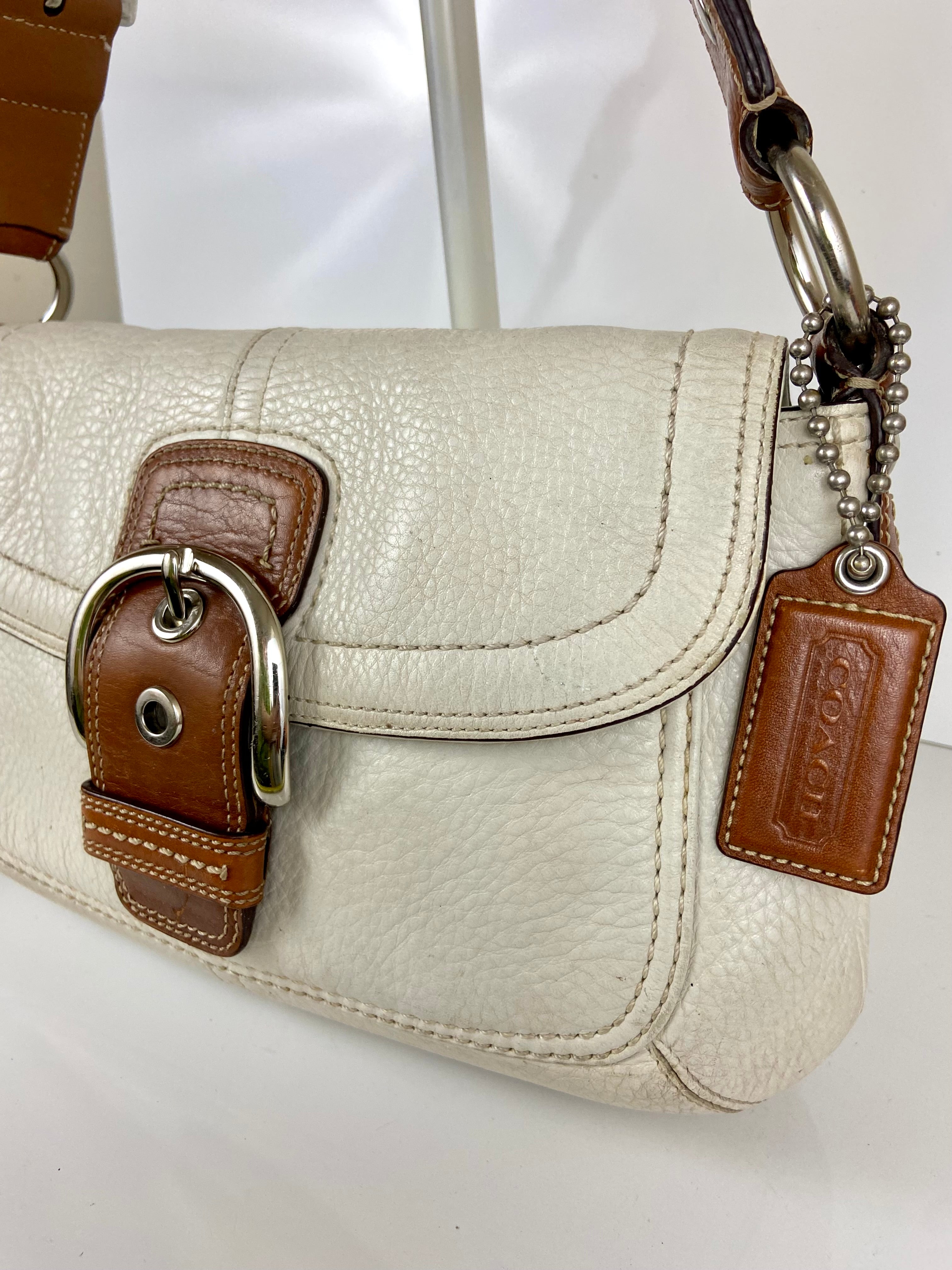 Coach Hampton Soho Satchel
Purse Ivory Saddle Leather F10192
Buckle Handbag