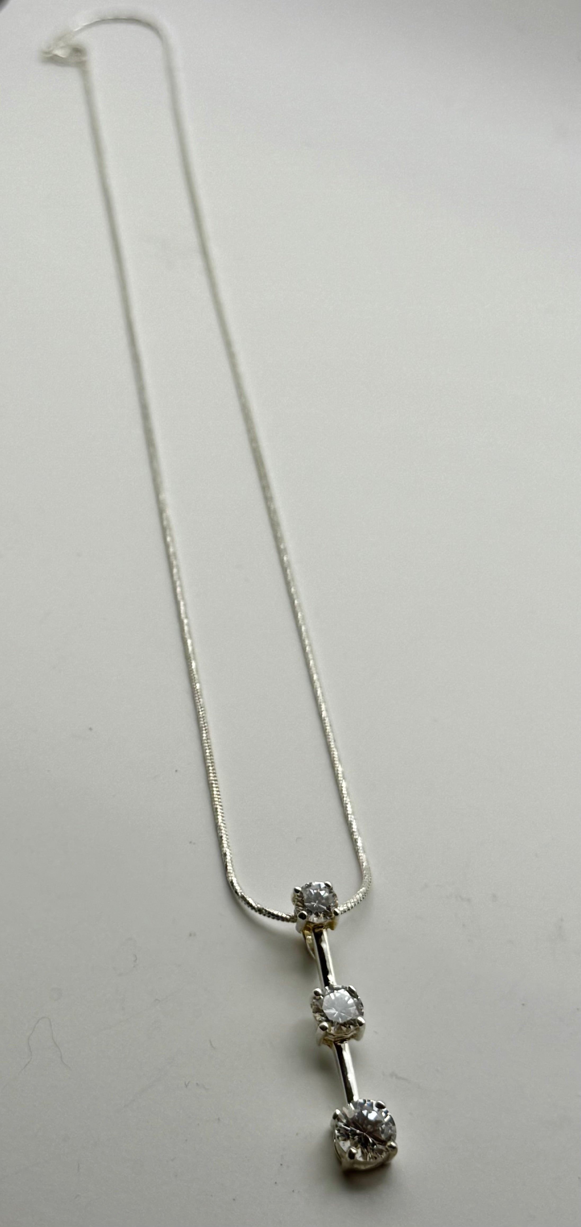 Three
Diamond Pendant necklace