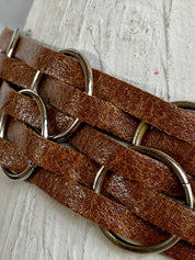 Brown leather belt with metal circle