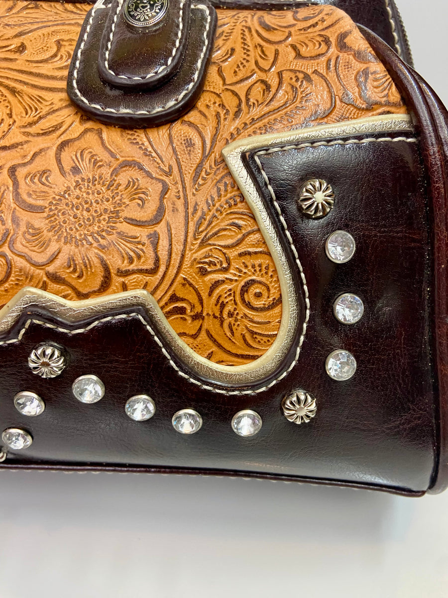 Hand tooled Western style leather wallets, checkbook covers, and purses.