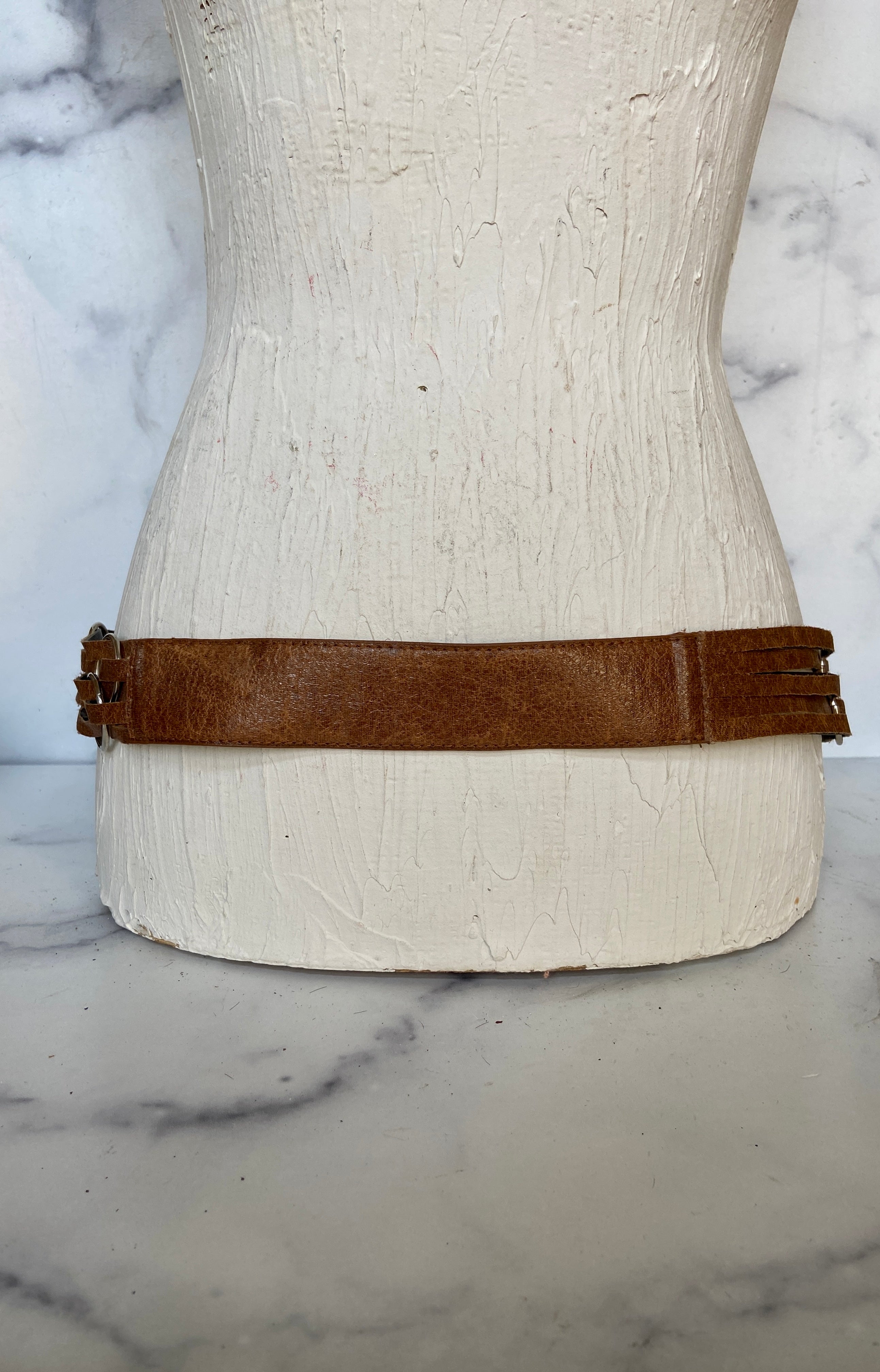 Brown leather belt with metal circle