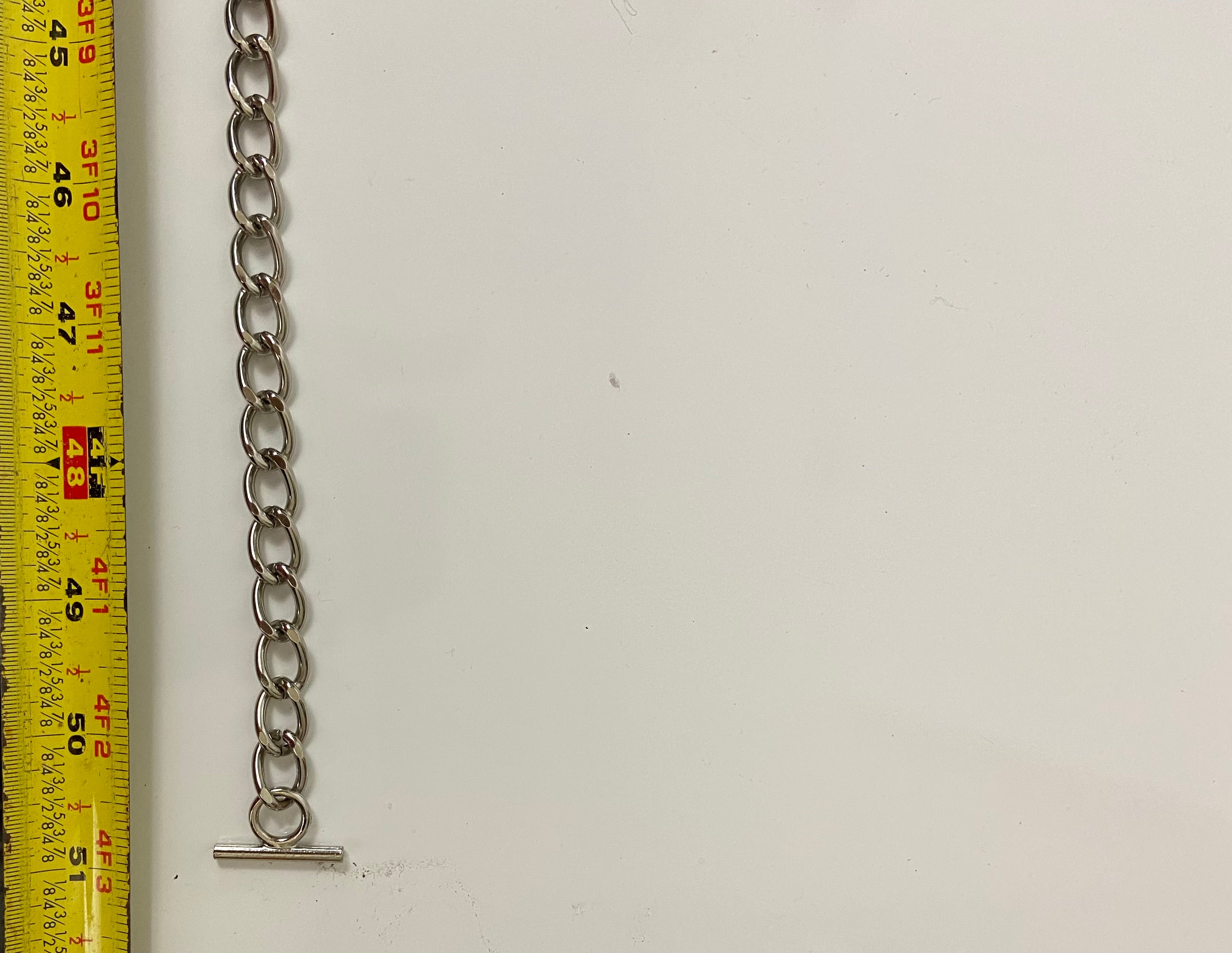 Reworked denim and chain belt