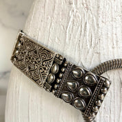Silver toned hammered metal stretch belt
