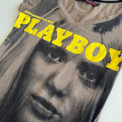 Gray t-shirt with a graphic of a dog and 'Playboy' text in yellow on a white background