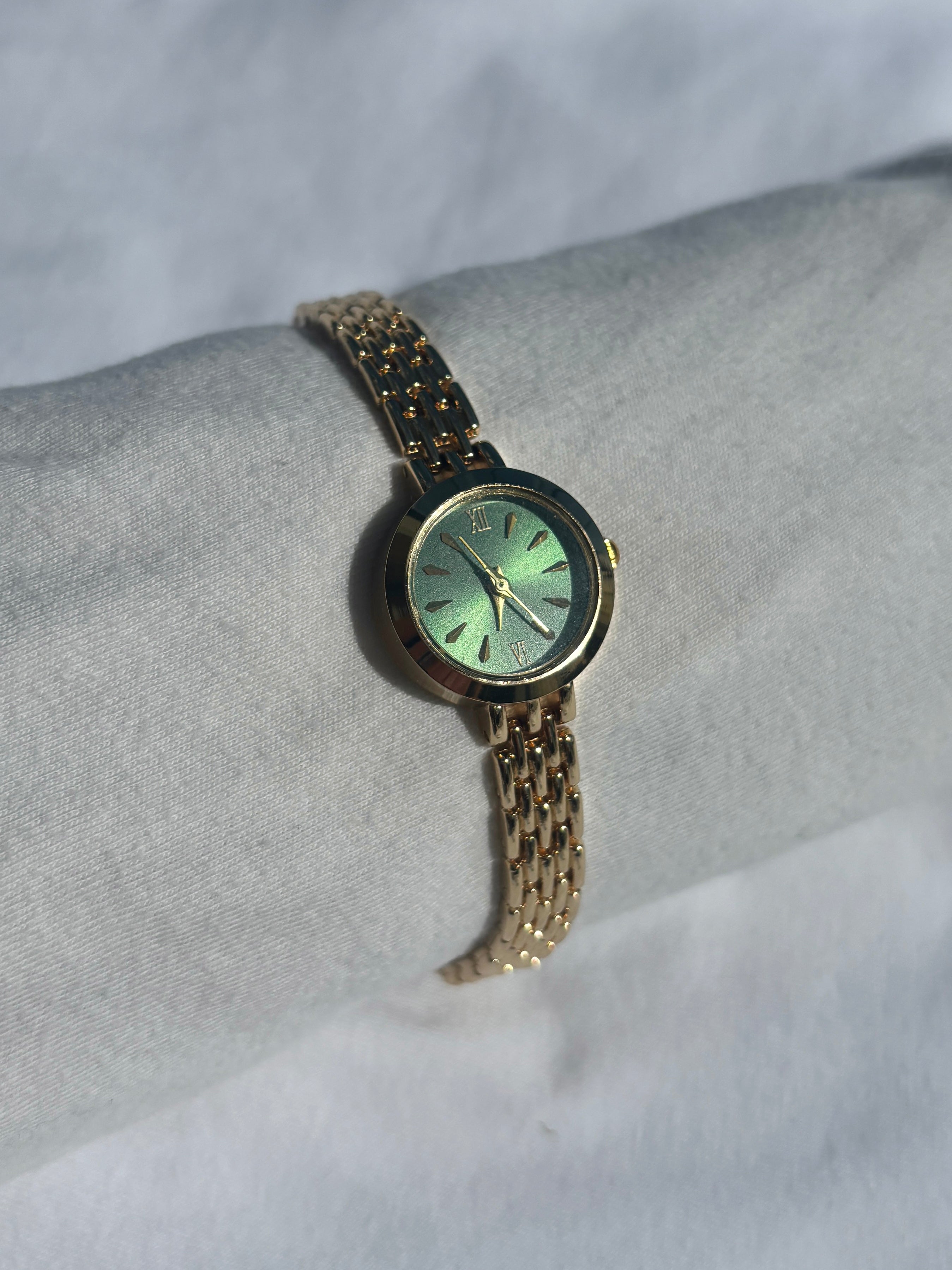 dainty 2000s forest green & gold watch