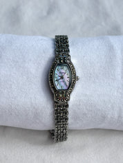 black crystal watch with cotton candy mother of pearl dial