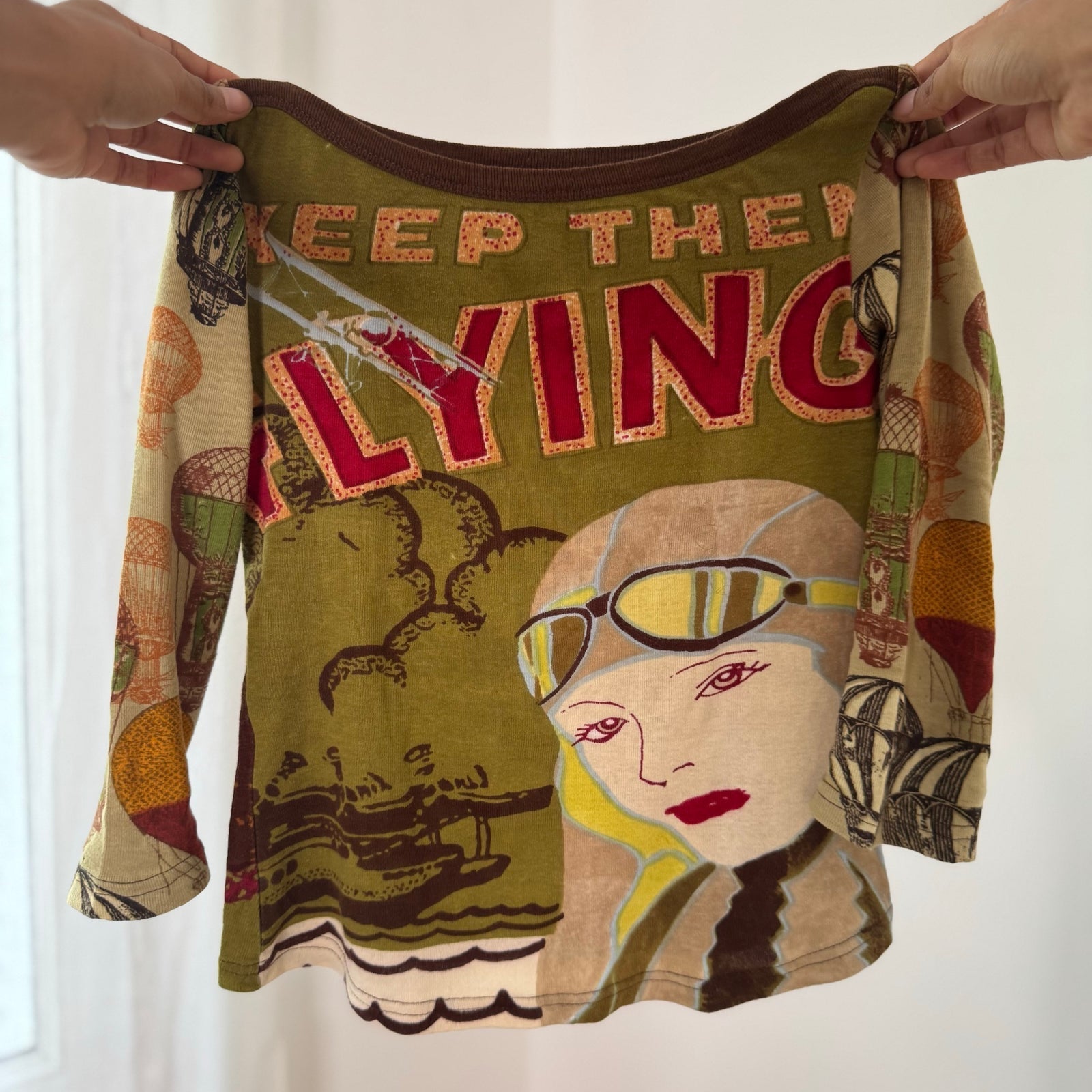 Euro vintage 00s olive green illustrated graphic top with lettering & retro aviator print