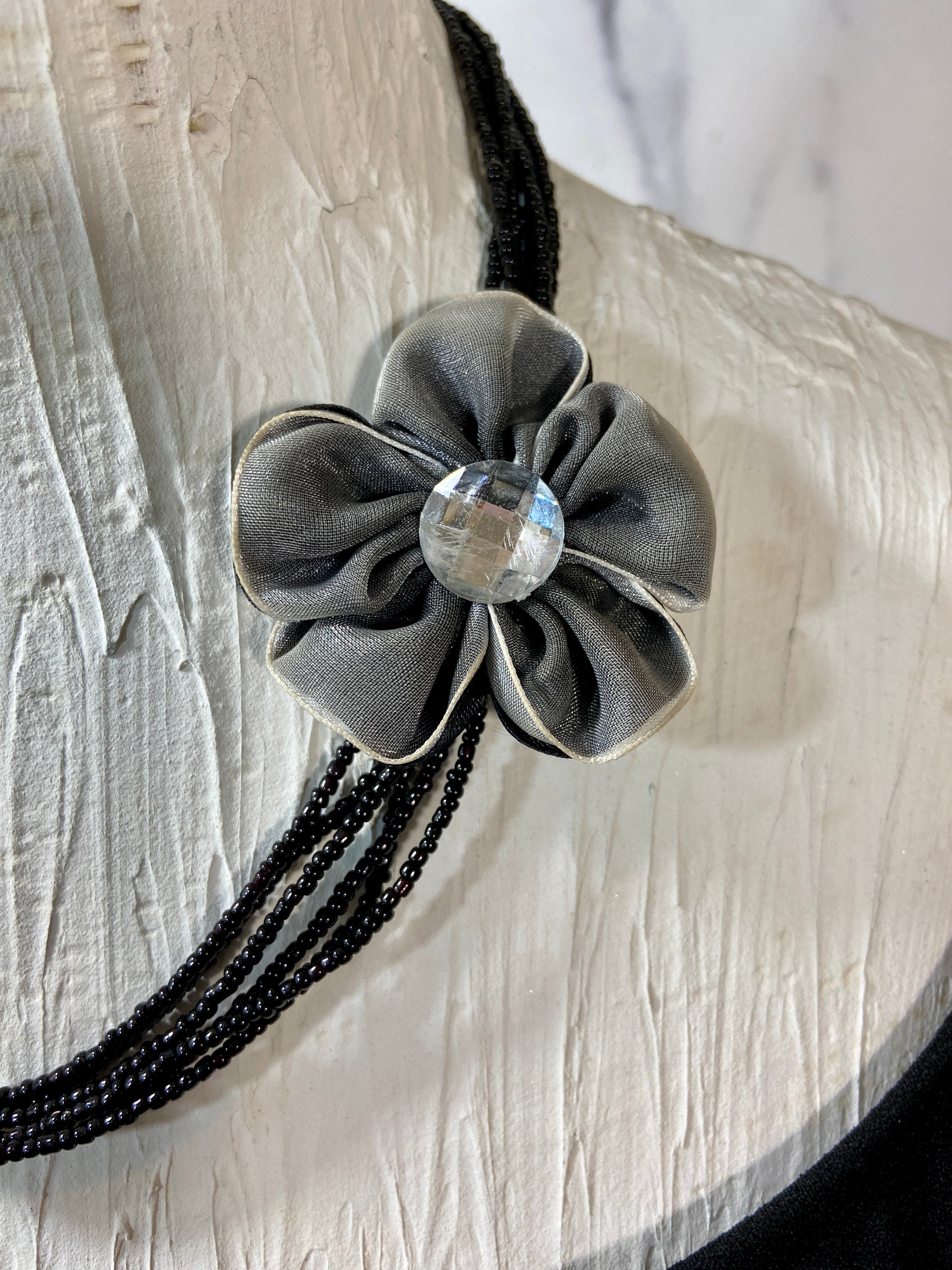Flower in a layered beads