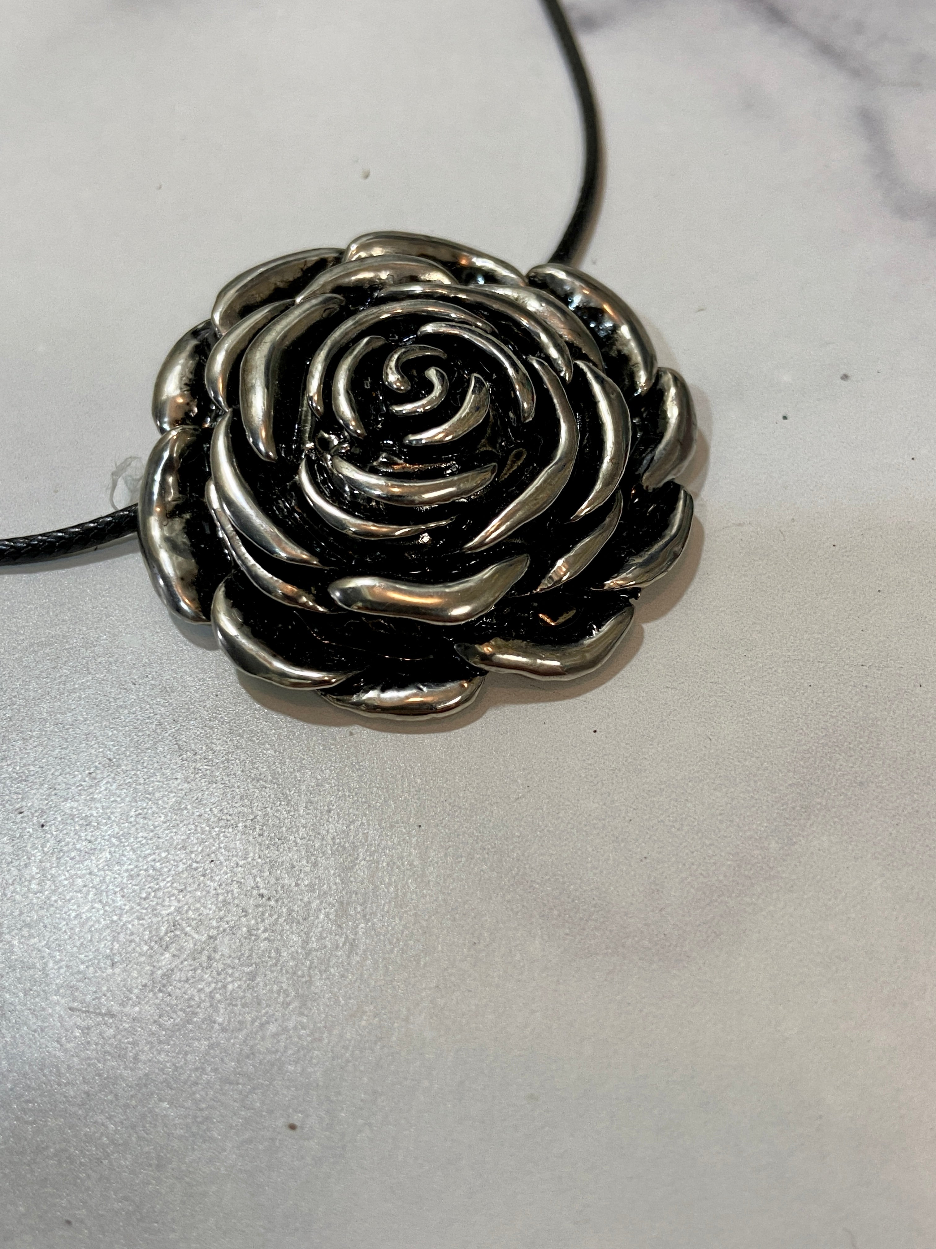 Flower pendant in a chain