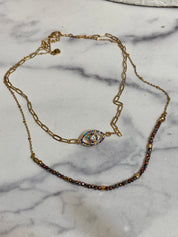 Gemstone evil eye in a chain