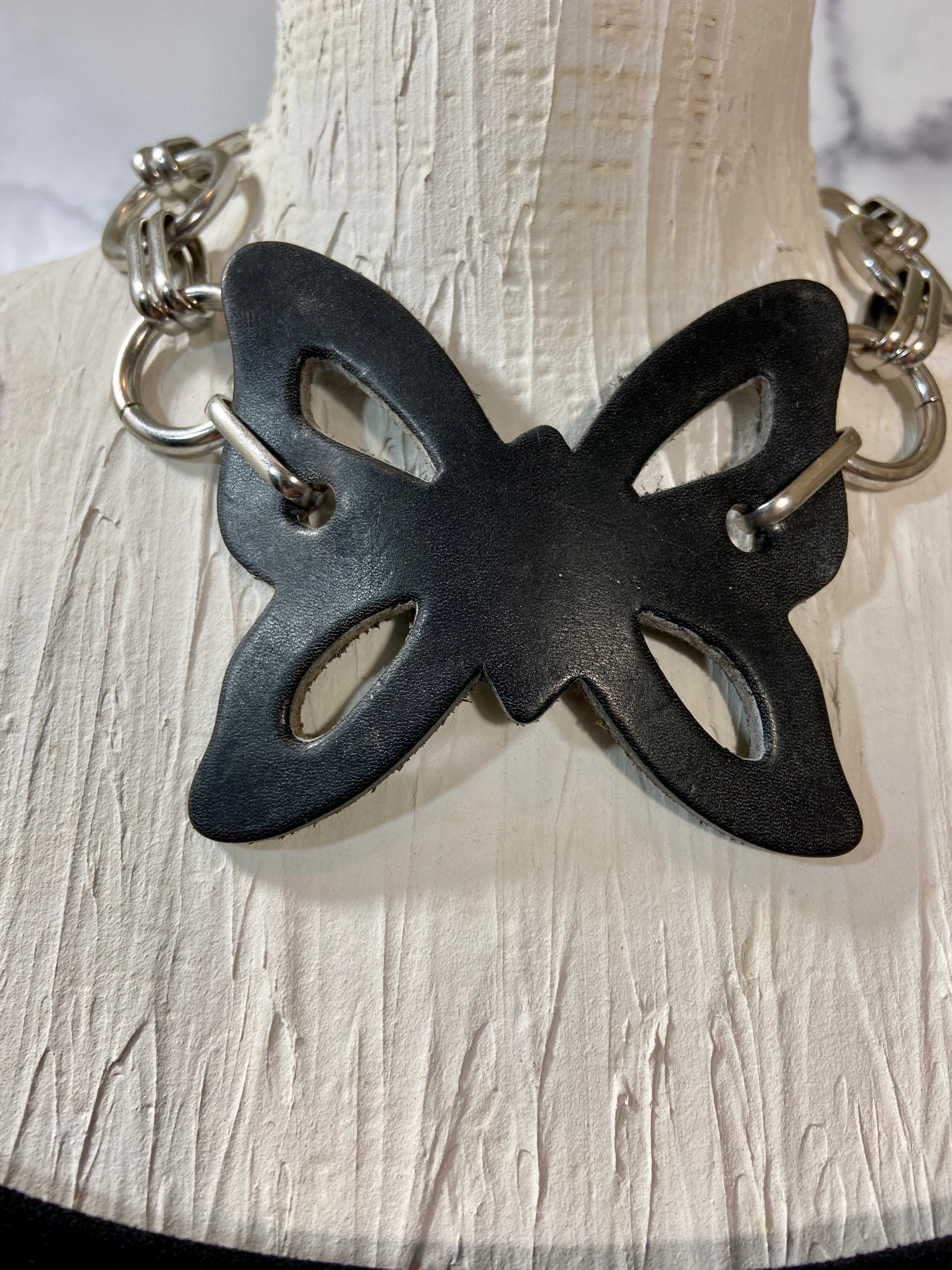 Leather butterfly in a chunky chains