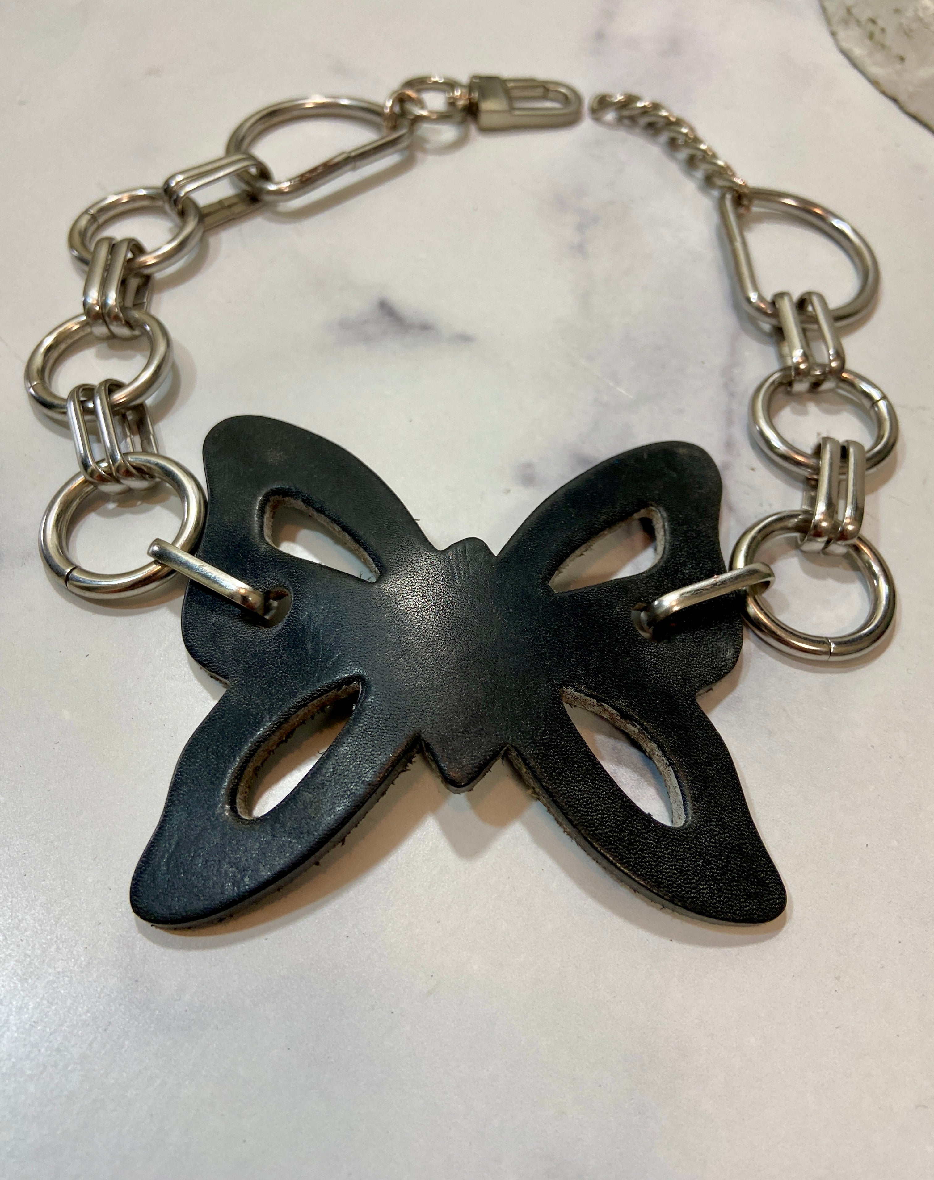 Leather butterfly in a chunky chains