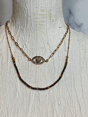 Gemstone evil eye in a chain