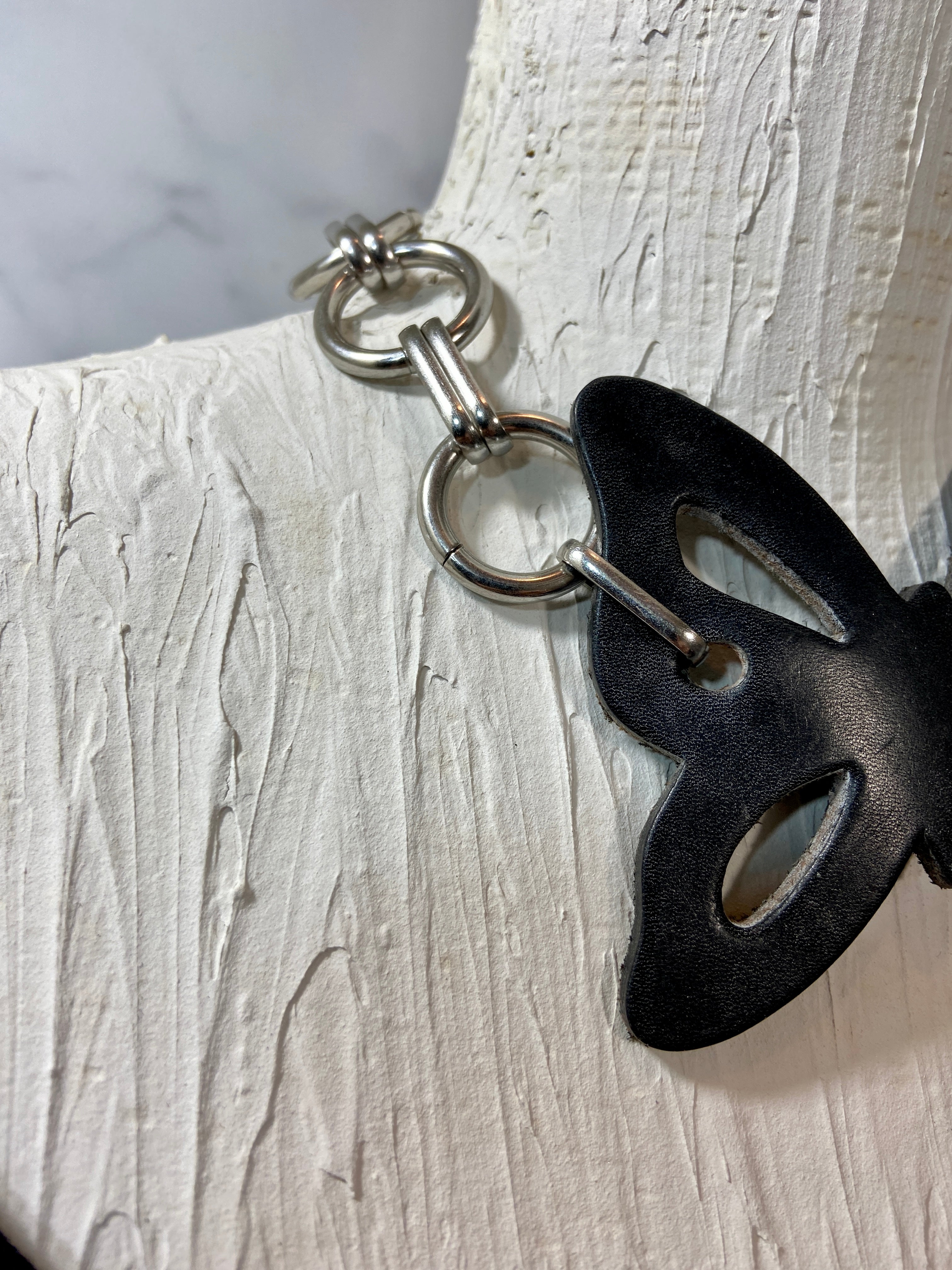 Leather butterfly in a chunky chains