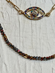 Gemstone evil eye in a chain