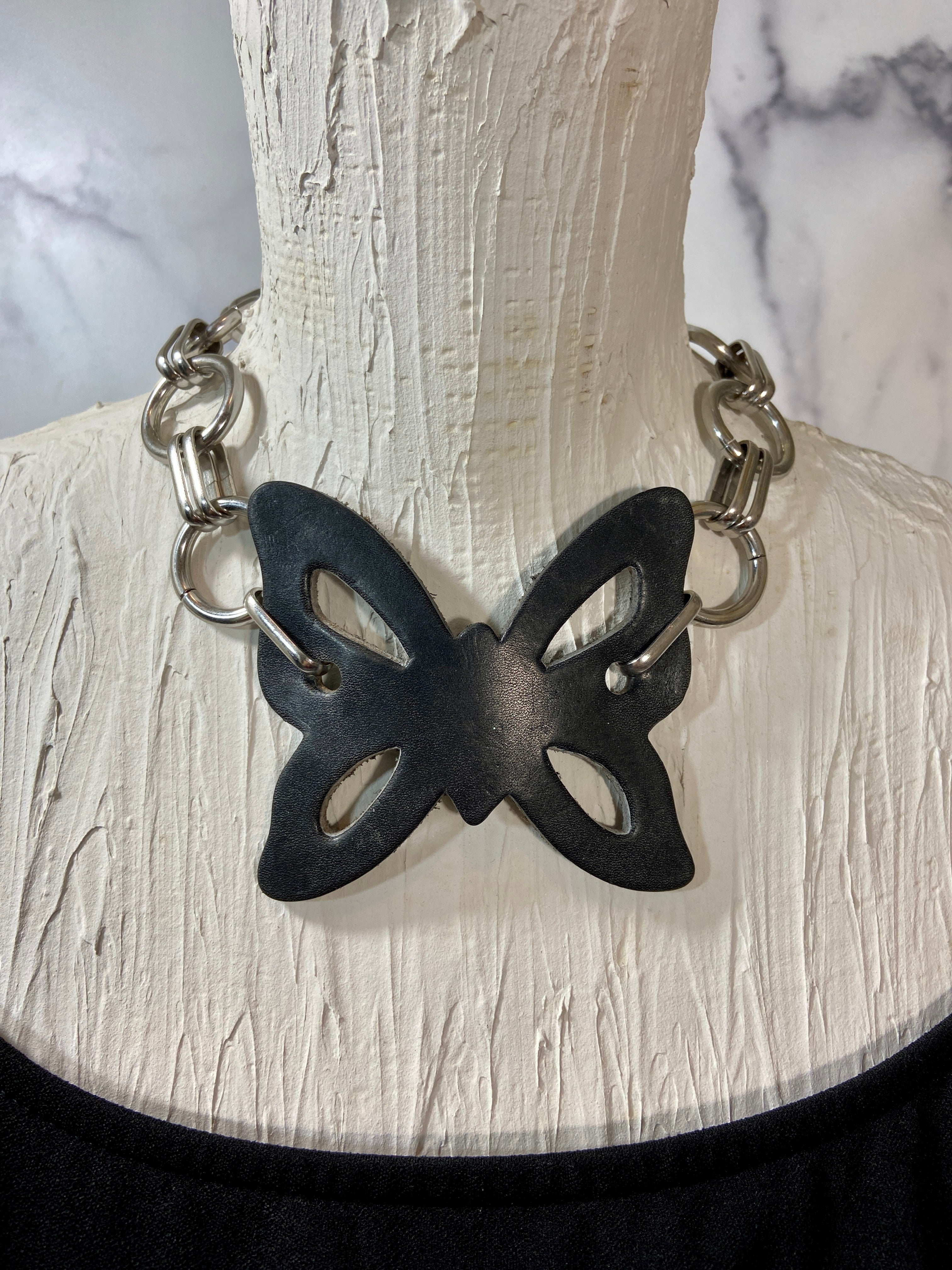Leather butterfly in a chunky chains