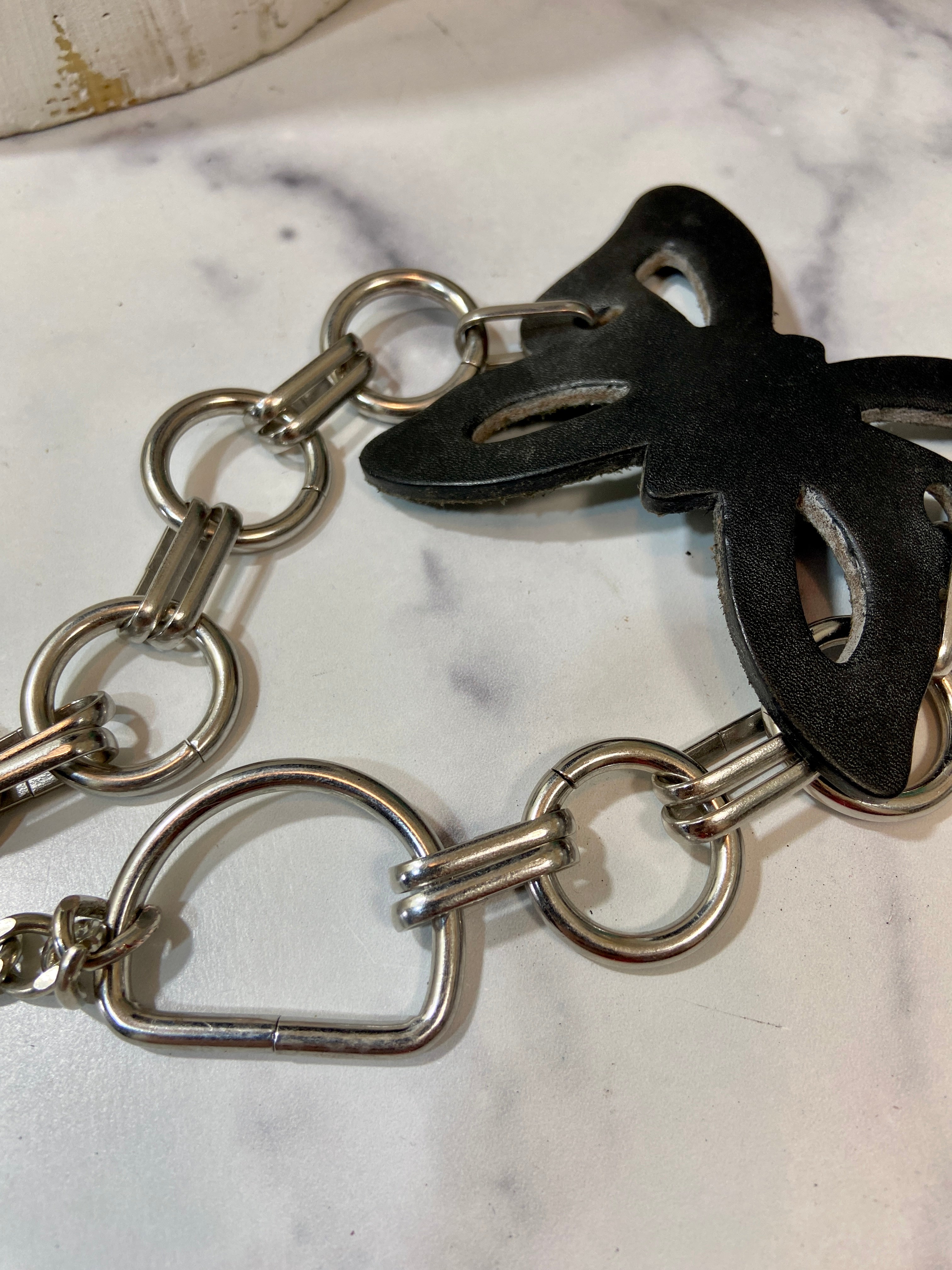 Leather butterfly in a chunky chains