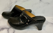 Black leather clogs