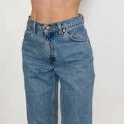 Vintage Levi's 950 High Rise Jeans in Medium Wash
