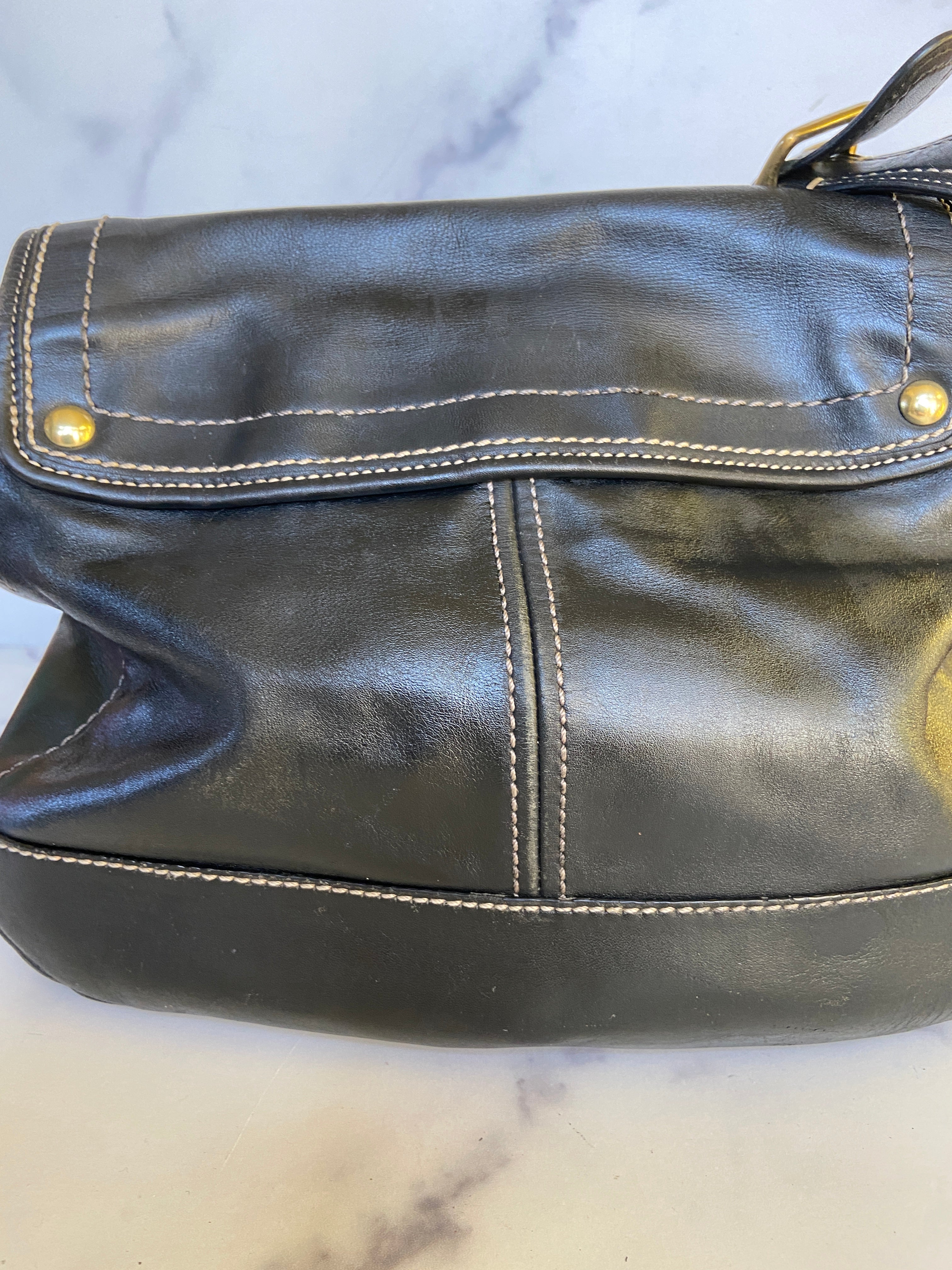 Reworked black leather coach