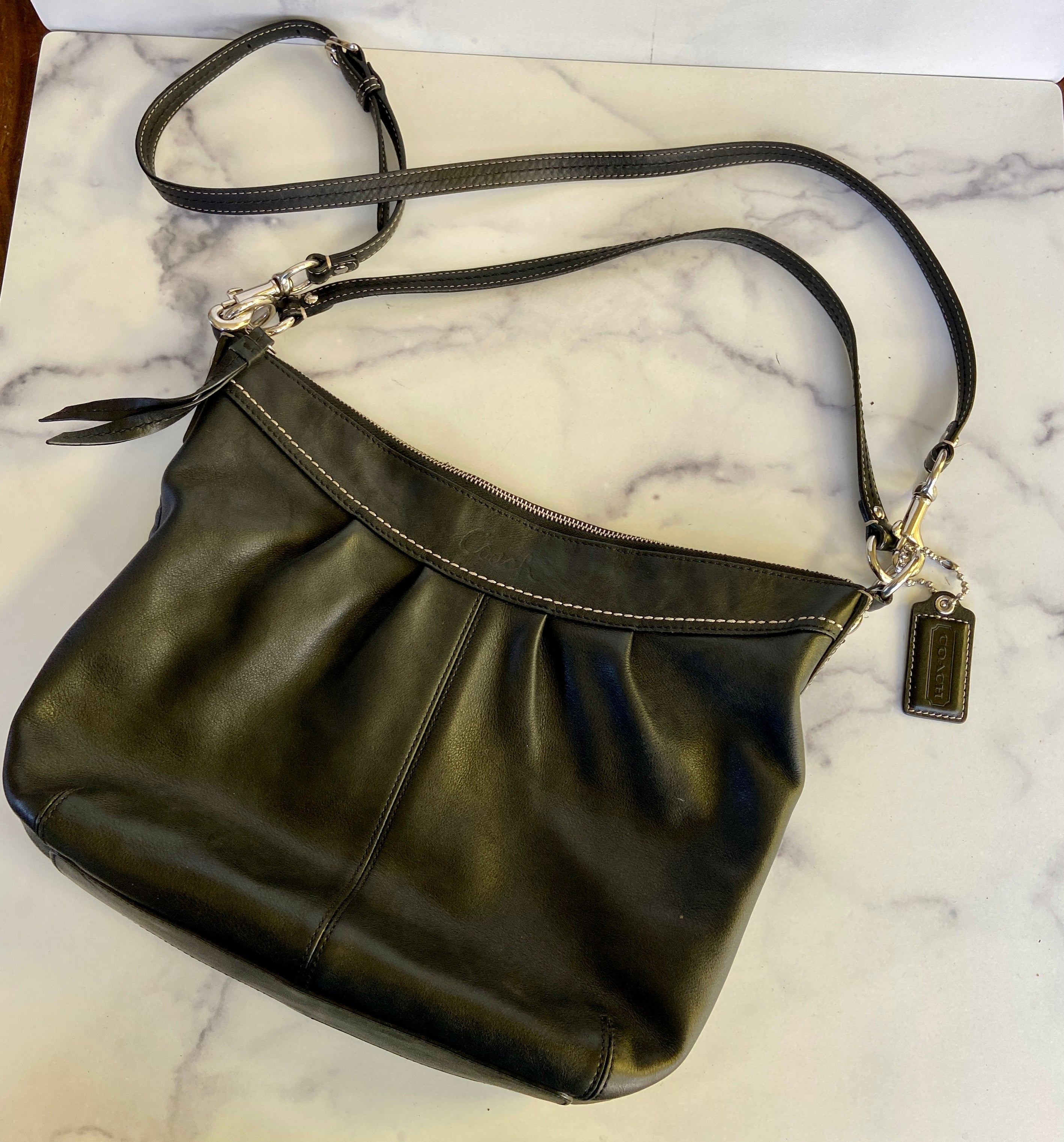 Soft black leather coach