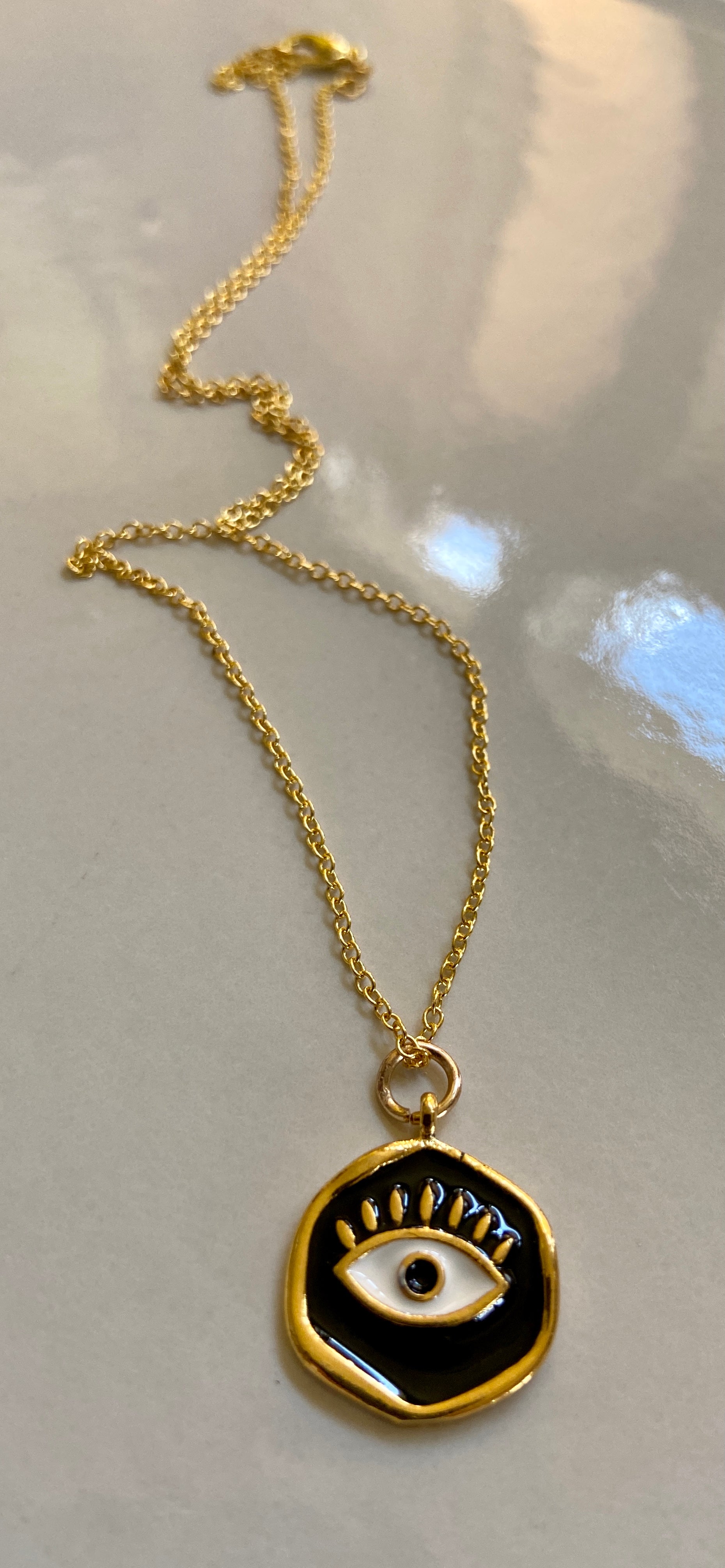 Black and gold evil eye