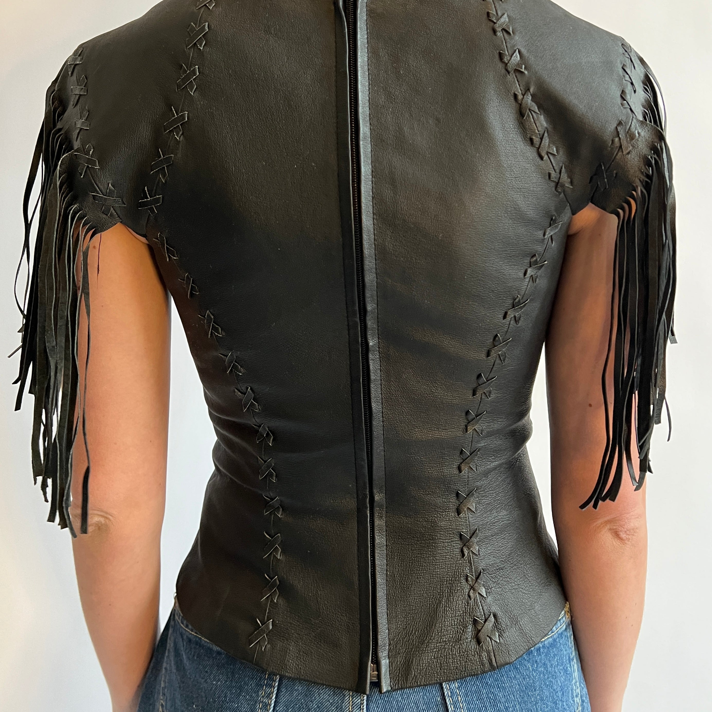 black leather stitch & fringe top
