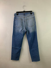 Distressed medium wash denim