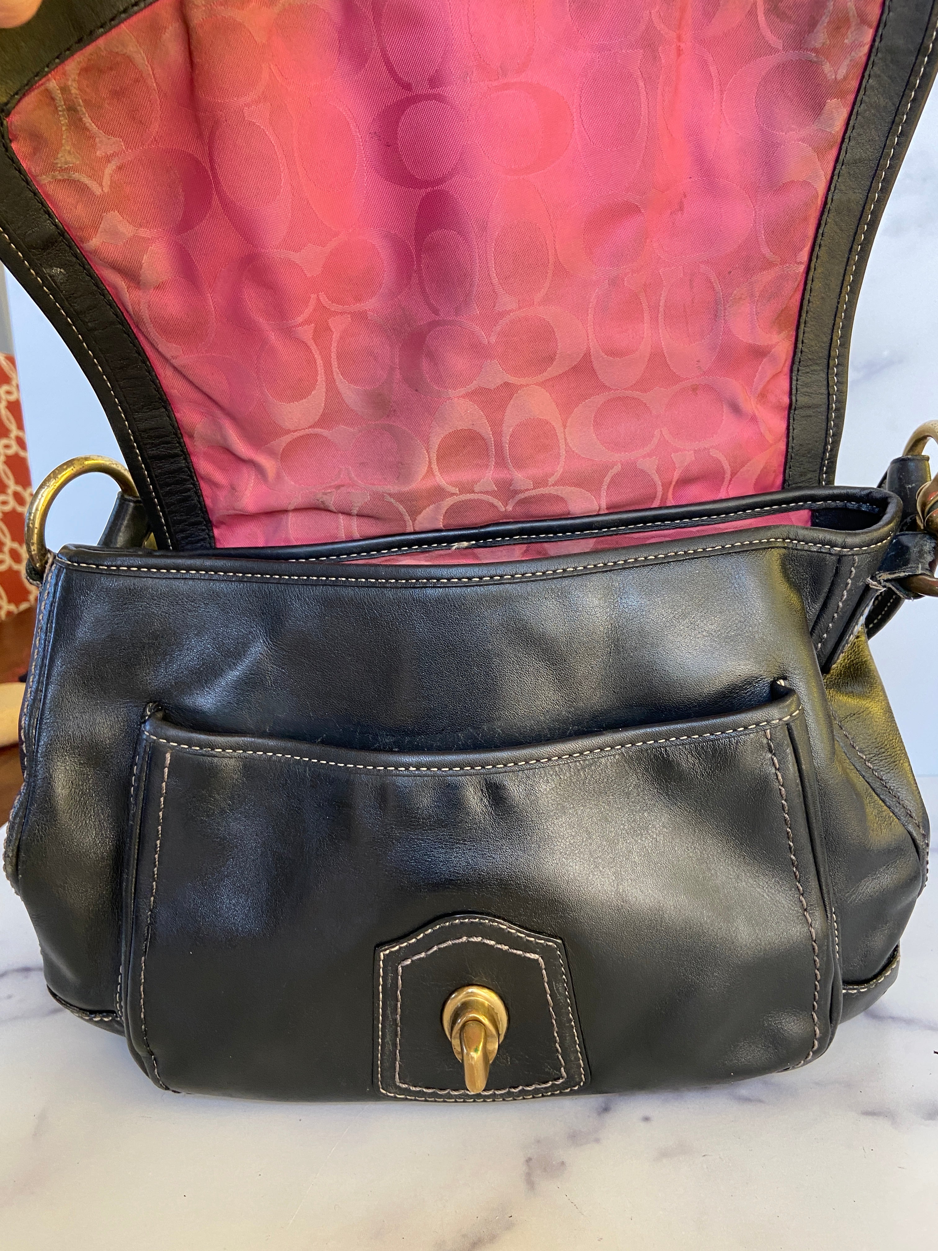Reworked black leather coach