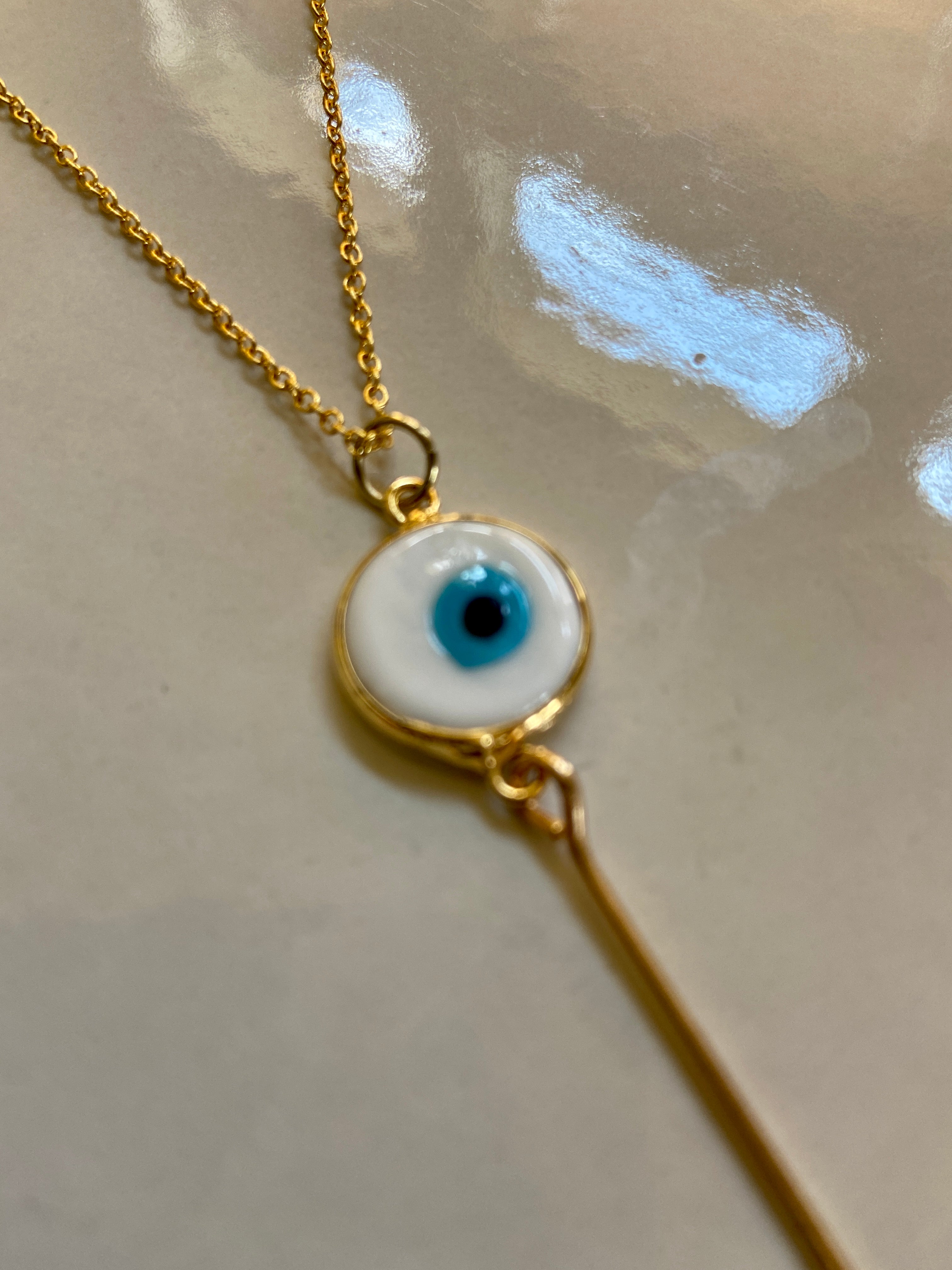 Black and gold evil eye