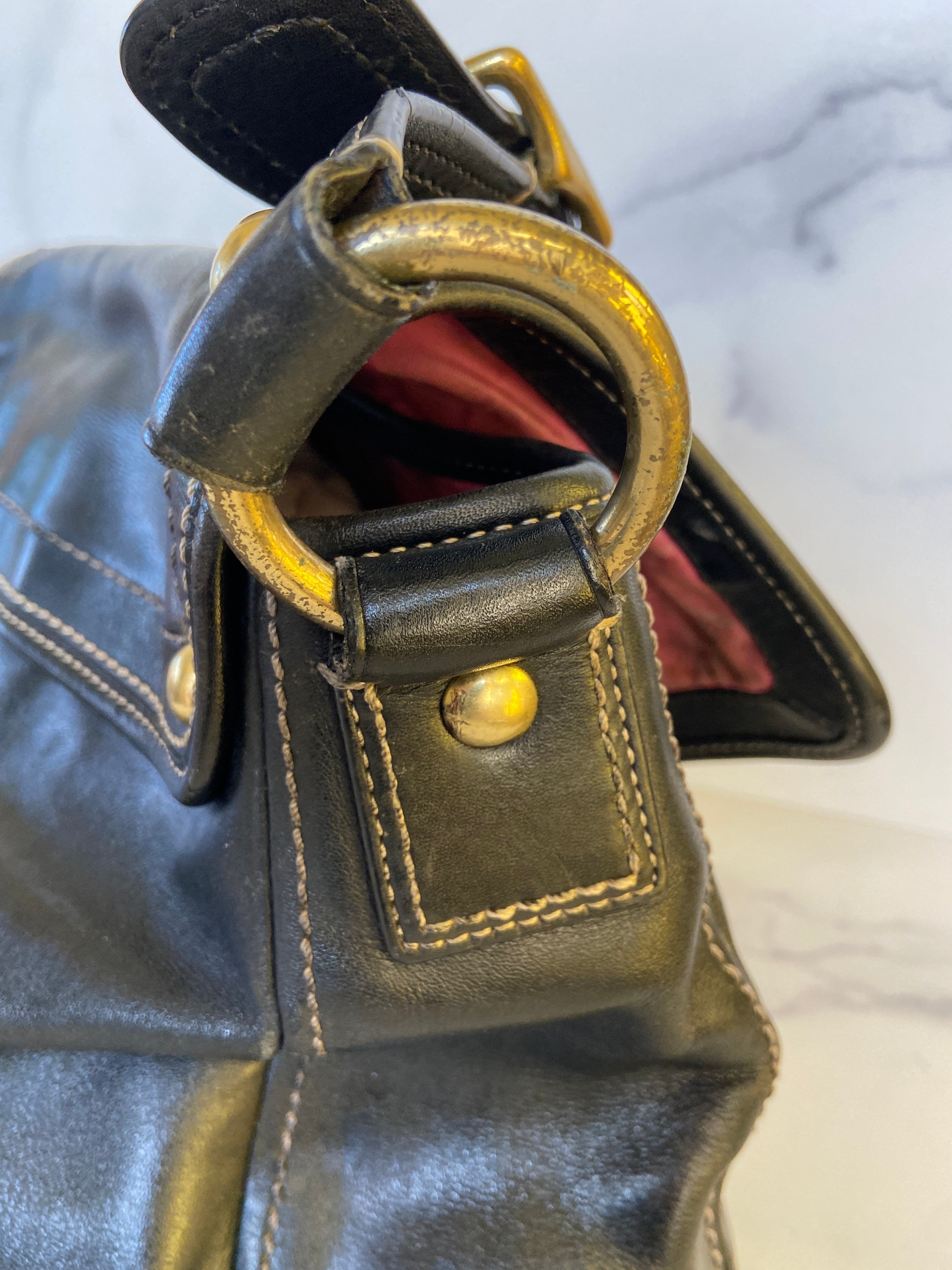 Reworked black leather coach