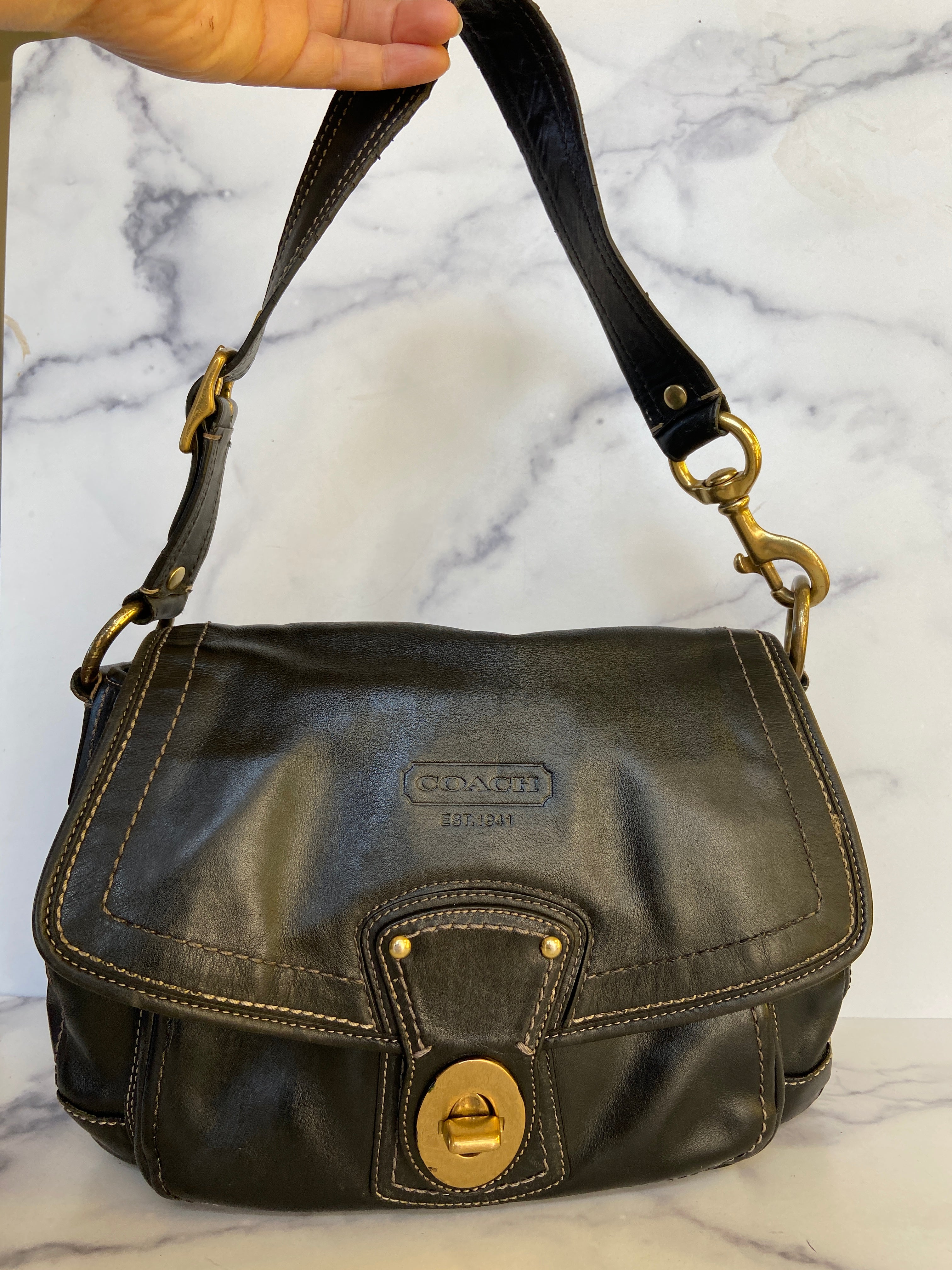 Reworked black leather coach